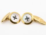 a pair of gold and mother of pearl cufflinks