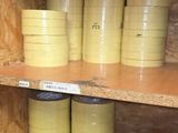 a shelf with many cans of paint on it