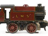 a toy train on a white surface with a white background