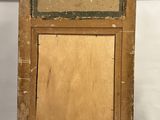 an old wooden easel with a piece of wood on top of it