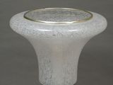 an image of a white vase with a gold rim on it