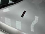 a close up of the hood of a car with a sticker on it
