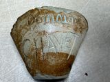 a stone with writing on it sitting on a table
