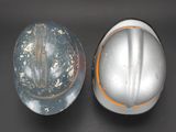 two helmets sitting next to each other on a table