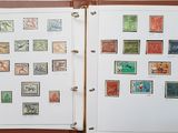 a lot of stamps on the pages of a binder