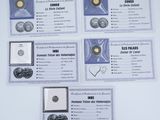 four different types of silver coins are displayed on a white surface
