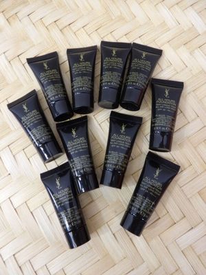 a bunch of black tubes sitting on top of a wooden floor