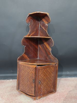 an image of a wooden corner cabinet with a shelf on top of it