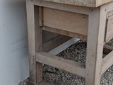 a wooden table with a drawer on top of it