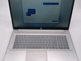 an open laptop computer sitting on top of a white table