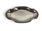 a silver plate with a decorative design on the edge