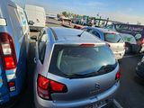 many cars parked in a parking lot next to each other