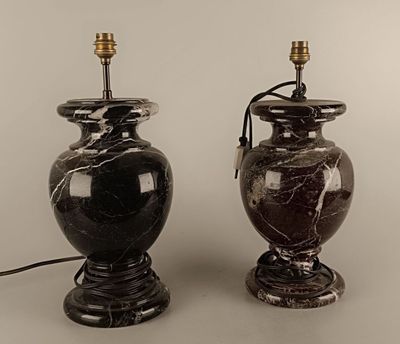 two lamps that are sitting next to each other on a table