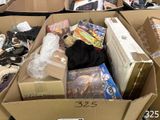 a cardboard box filled with many different items in it