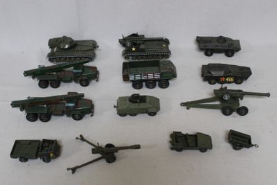 a lot of toy army vehicles on a white surface