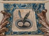 a blue and white clock with a bird on it ' s face