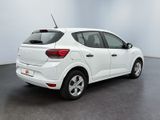 the rear end of a white car parked in a room