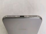 a close up of the back of a silver iphone