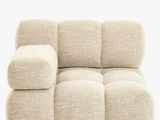 an image of a beige couch with pillows on it