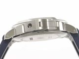 a close up of a watch on a white surface