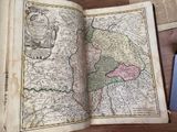 an open book with a map of the country of england on it