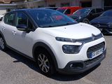 a white citrole parked in a parking lot