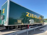a semi truck that is parked on the side of the road