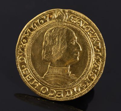 a gold coin with an image of a man on it