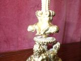 a gold statue sitting on top of a wooden table