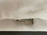 a piece of paper that has been pinned to a piece of cloth