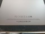 a close up of the back of a laptop with a barcode on it