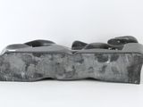 sculpture of a pair of shoes on a white surface