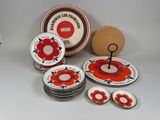 many plates and bowls that are sitting on a table
