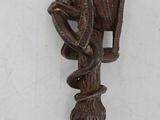 an image of a wooden wall hook with a bird on it