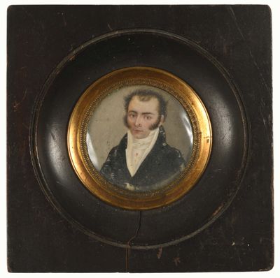 portrait of a man in a black suit and white shirt in a gold frame