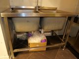 two sinks that are under a counter in the kitchen