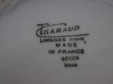a close up of a white plate with black writing on it