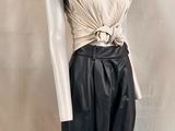 black leather pants with a white top and a white shirt on a mannequin mannequin mannequin mannequin mannequin mannequin mann