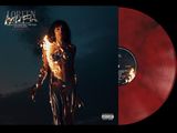 a red vinyl album with a picture of a man holding a fire