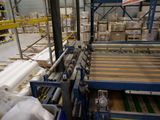 an image of a factory with a conveyor belt and a conveyor belt