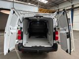 a white van with its doors open in a garage