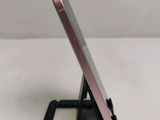 a cell phone that is sitting on top of a stand
