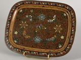 a decorative tray with flowers and birds on it