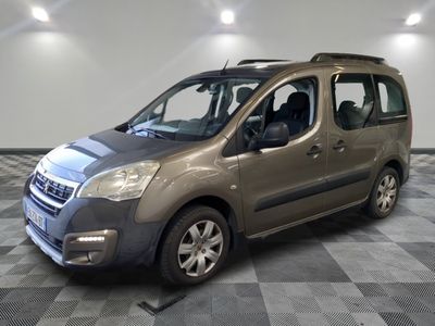the small van is parked in a large room with a checkered floor