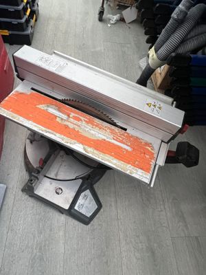 a table saw sitting on top of a table in a store