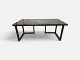 an image of a black table with a glass top on a white background