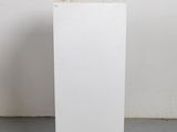 a white box with a hole in it sitting on the floor