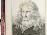 portrait of a man with long curly hair and a black jacket
