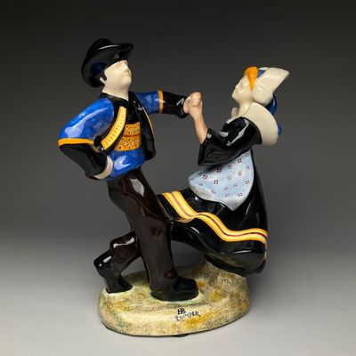 a figurine of a man and woman dancing