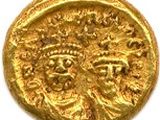 une pièce d'or sur laquelle sont représentés le visage d'un homme et celui d'une femme